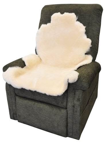 Natural Sheepskin Pad Large Size draped on armchair, soft natural wool for comfort and skin protection.