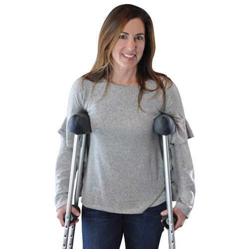Woman using crutches with Soft n' Plush Comfort Crutch Pillows Set for arm and wrist comfort and support.
