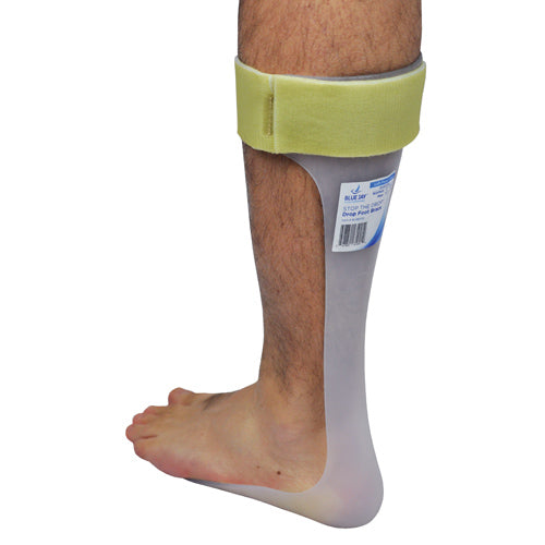 Light-colored ankle-foot orthosis with beige adjustable strap fitted on lower leg and foot against white background