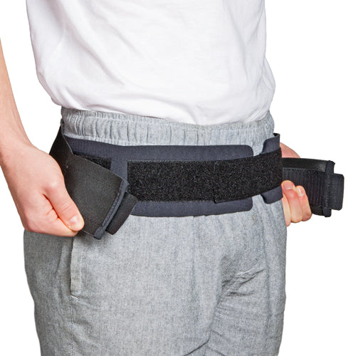 Blue Jay Sacroiliac Belt Black Small 30-34 shown being fastened around waist for lower back support.