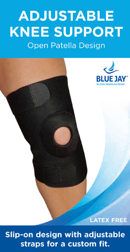 Black adjustable knee support with open patella and hook and loop straps on bare leg against white background