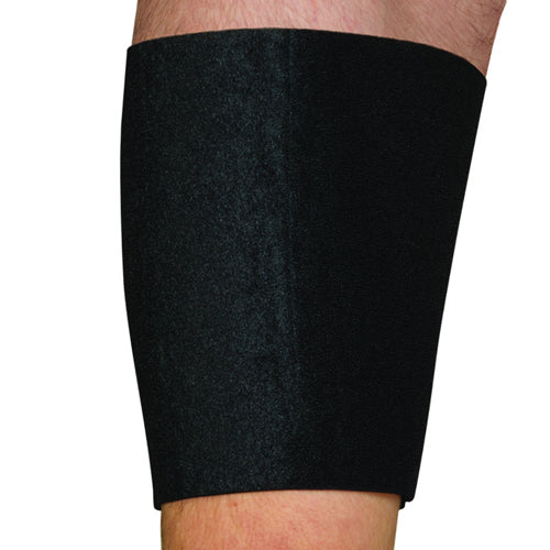 Black neoprene thigh support sleeve worn on upper leg against white background