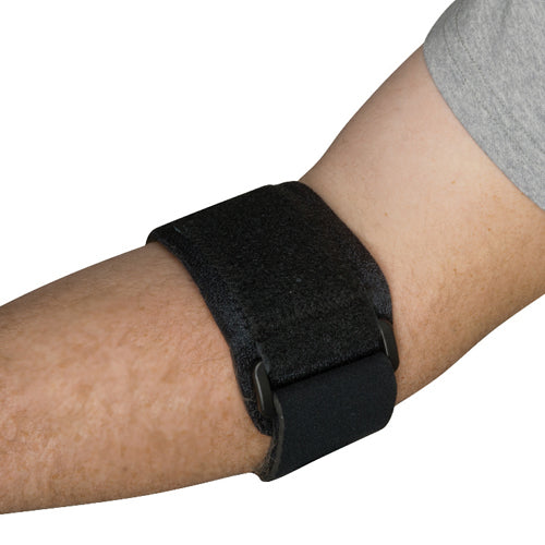 Black adjustable strap fastened snugly around a person's forearm against a white background