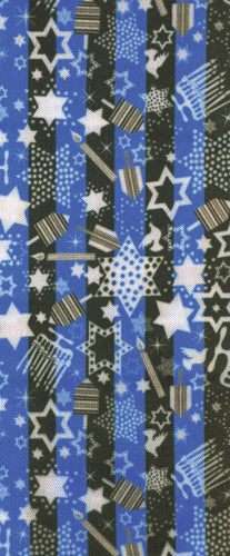 Close-up of fabric with vertical black and blue stripes decorated with various sized white and tan stars and geometric patterns