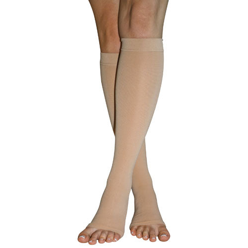 Firm Surg Weight Stkngs 3Xlg 20-30mmHg Below Knee Open Toe beige compression stockings on legs for circulation.