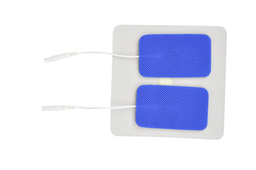 Two rectangular blue adhesive electrode pads with textured surfaces and white connector wires on a white backing sheet